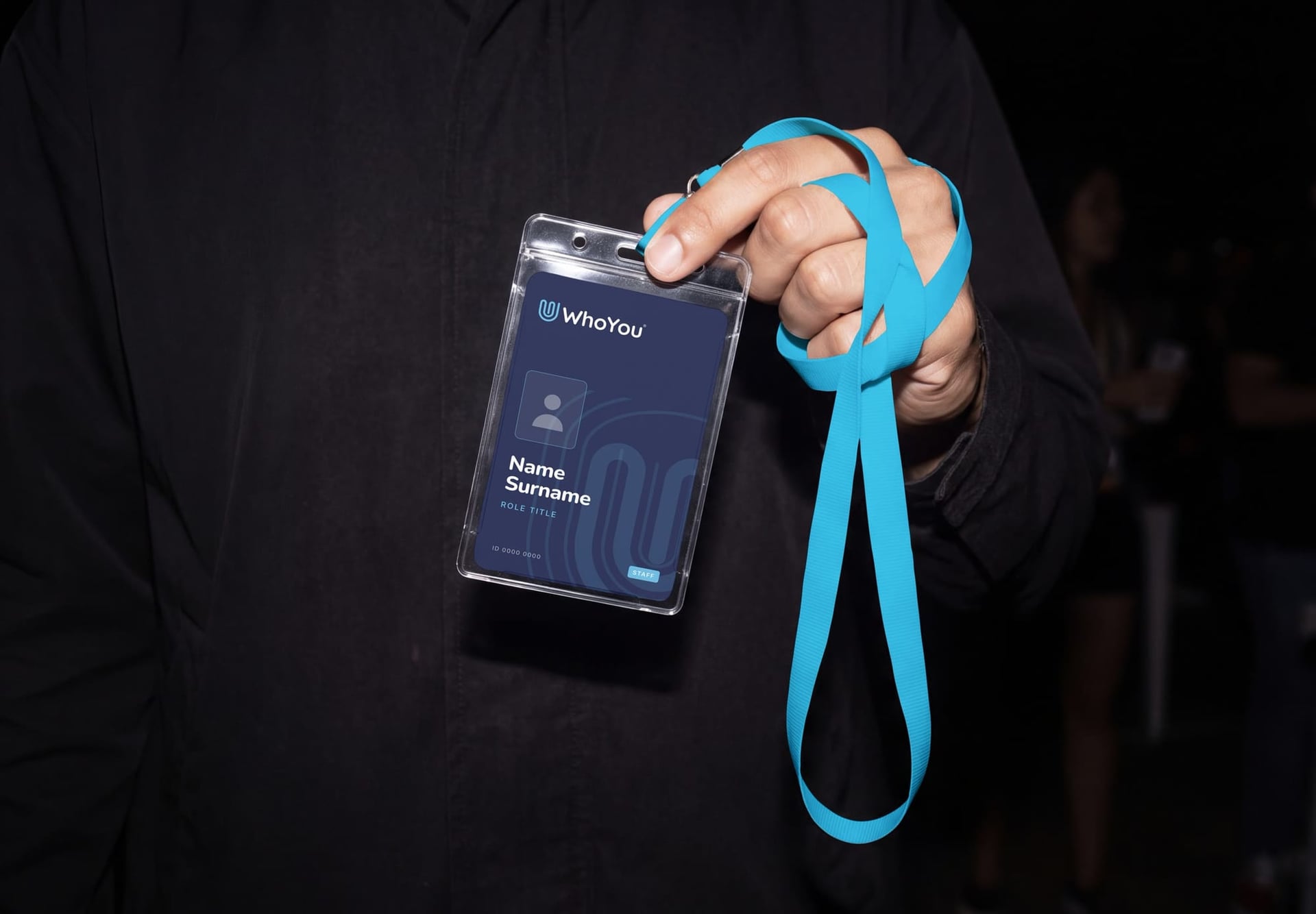 WhoYou staff badge on a lanyard