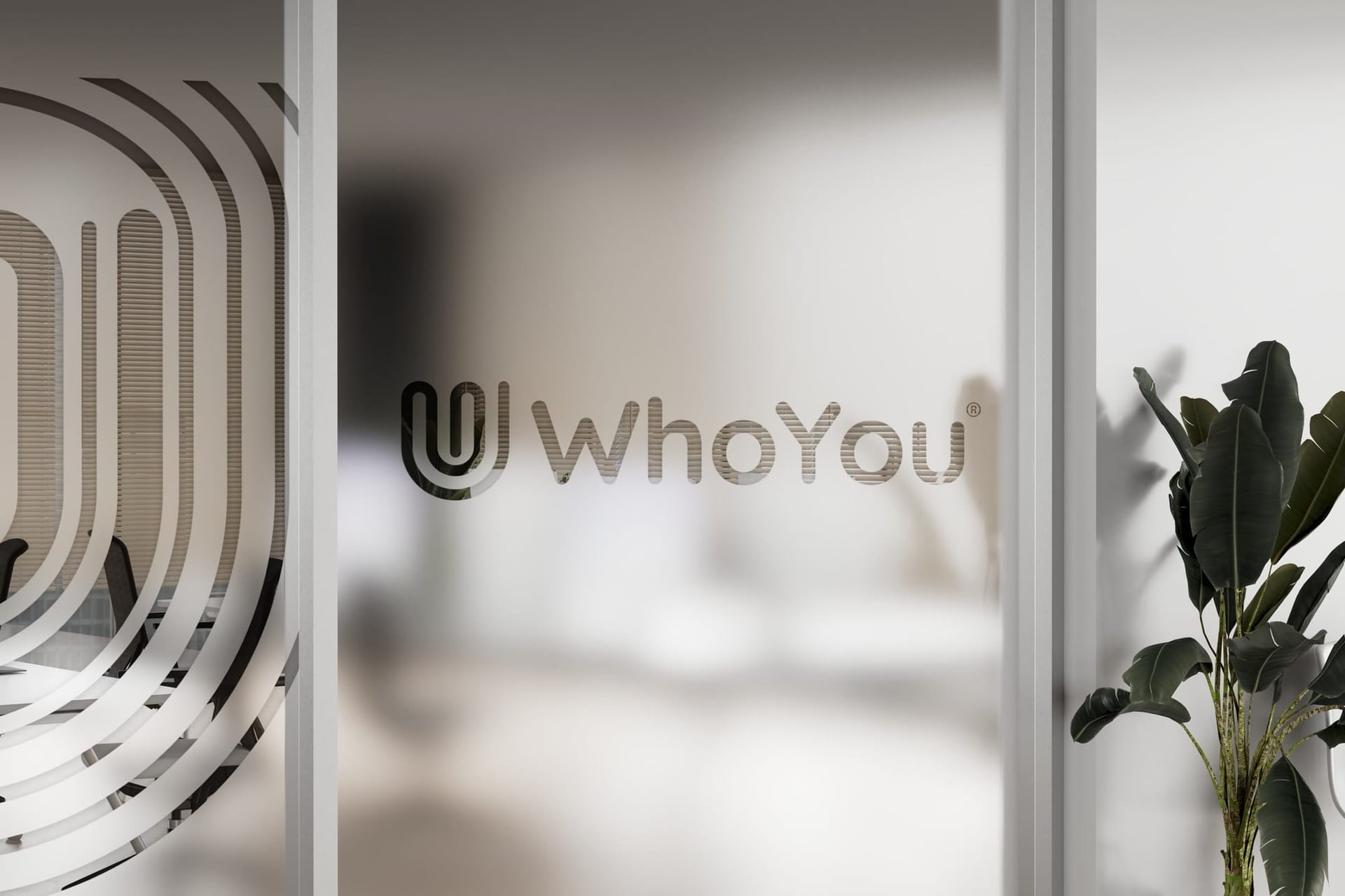 WhoYou mark etched on a glass partition
